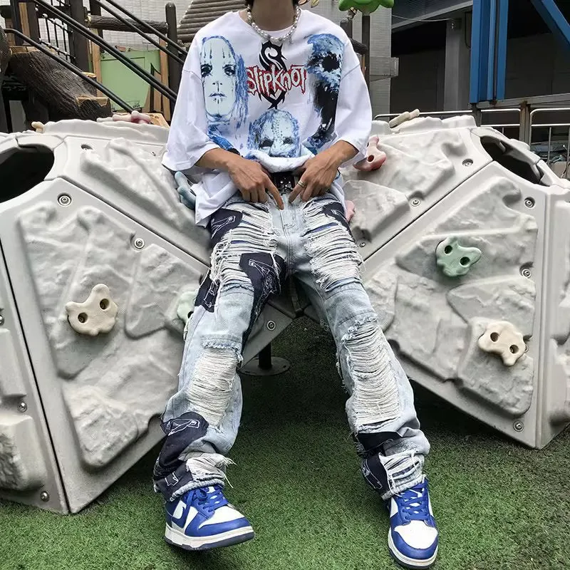 New splicing cross-style ripped slim fit jeans